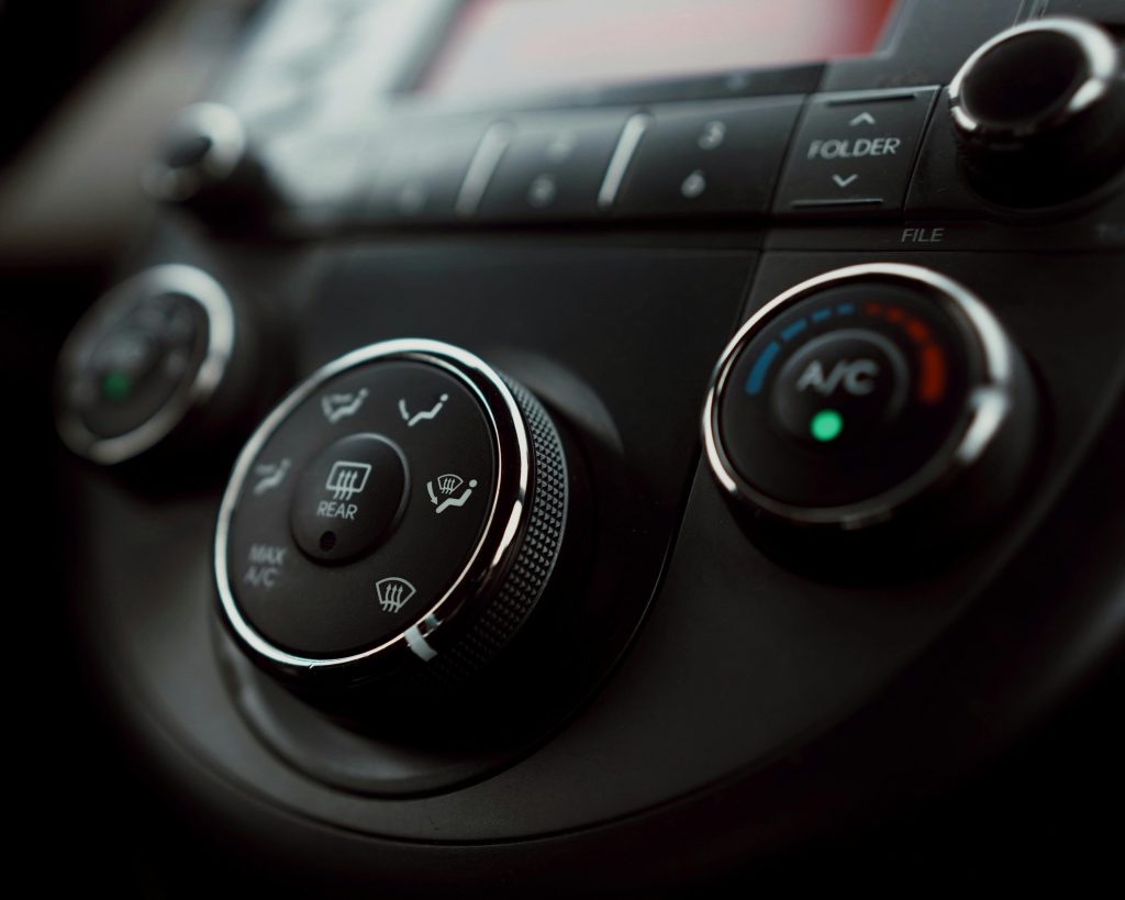pexels photo 11091205 11091205 Detailed close-up of car dashboard air conditioning controls with focus on buttons and dials.